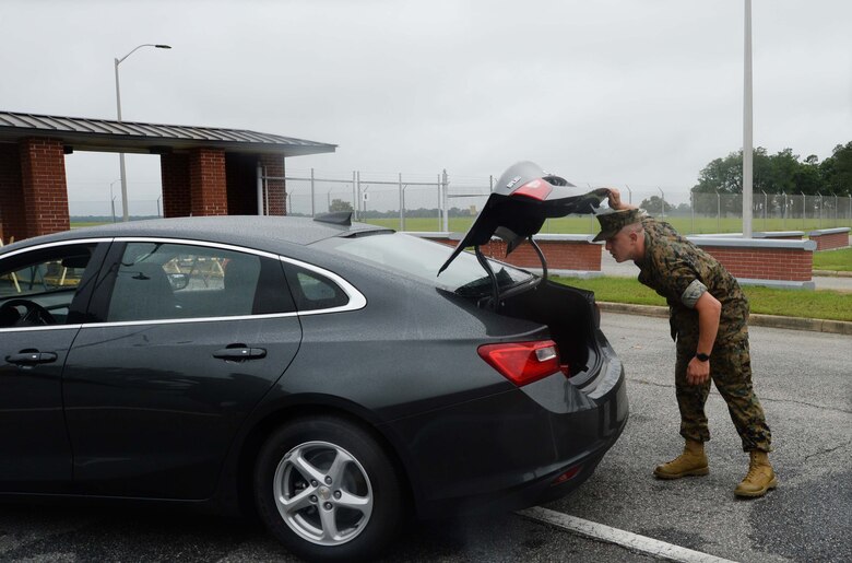 Cpl. Keaton Kane, Administration Clerk, Military Personnel, Marine Corps Logistics Base Albany, conducts a vehicle search during a “Lost-Child” full-scale exercise on the installation, June 13. The scenario was implemented in collaboration with the city’s mutual partners to train participants on reaction and response time in the event an actual occurrence of this type happened. There were roughly 50-60 personnel from the base as well as the city’s mutual partners, who participated in the day-long event.