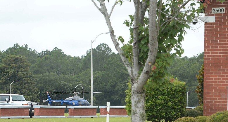 The Georgia State Patrol Aviation team lands a helicopter on Marine Corps Logistics Base Albany’s Schmidt Field, in front of Building 3500, during a Lost-Child” full-scale exercise, June 13. The chopper team provided air support and infrared surveillance in efforts to locate the missing youngster. The training scenario was implemented in collaboration with the city’s mutual partners to evaluate participants on reaction and response time in the event an occurrence of this type actually happened.