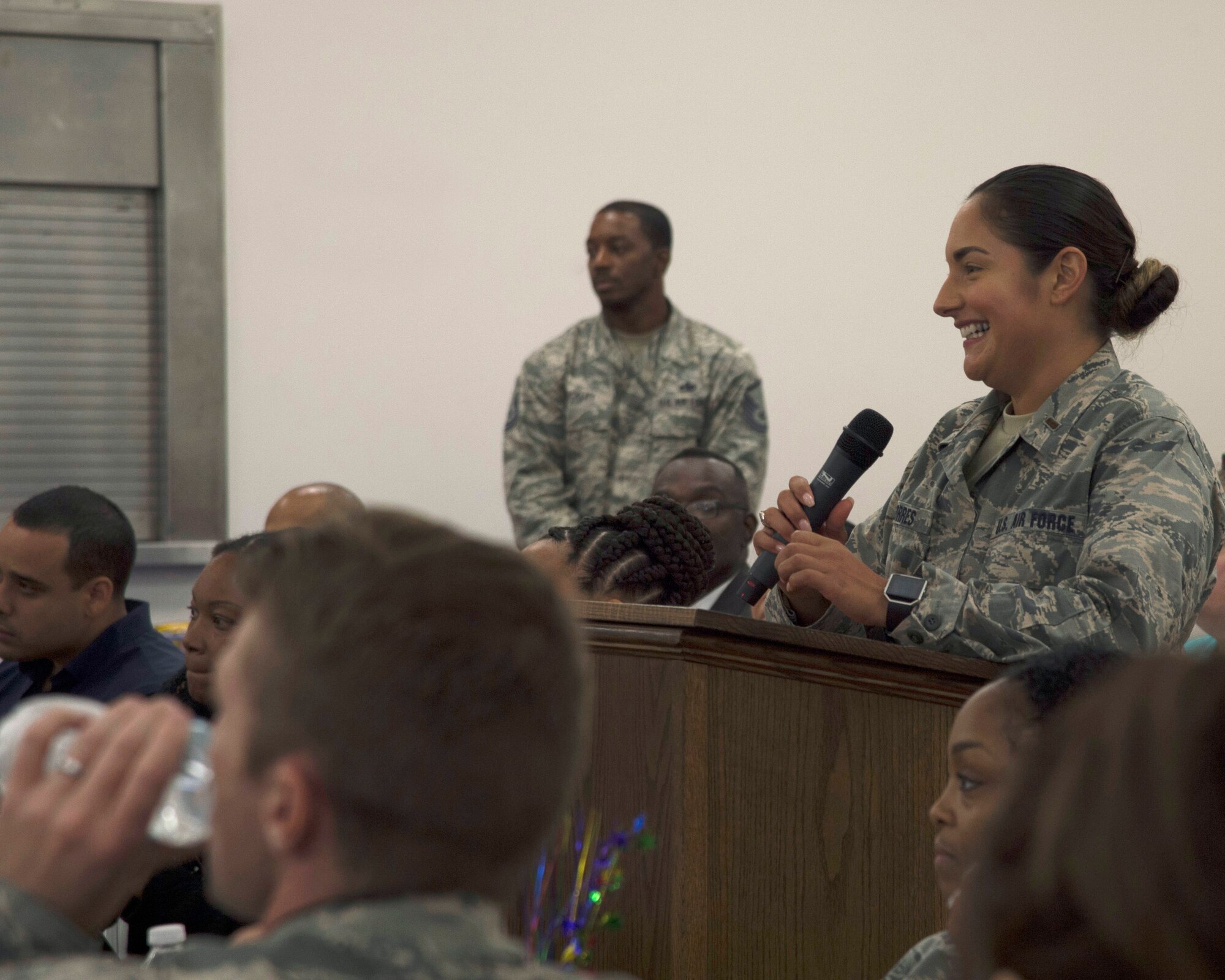 U.S. Air Force 2nd Lt. Magdalena Torres, the base support flight officer in charge assigned to the 6th Contracting Squadron, asks a question for the panel during a Pride Luncheon at MacDill Air Force Base, Fla., June 15, 2017. Torres is a member of the Pride Committee and said the goal for this year is to focus on educating members of MacDill about the significance of the month. (U.S. Air Force Photo by Airman 1st Class Ashley Perdue)
