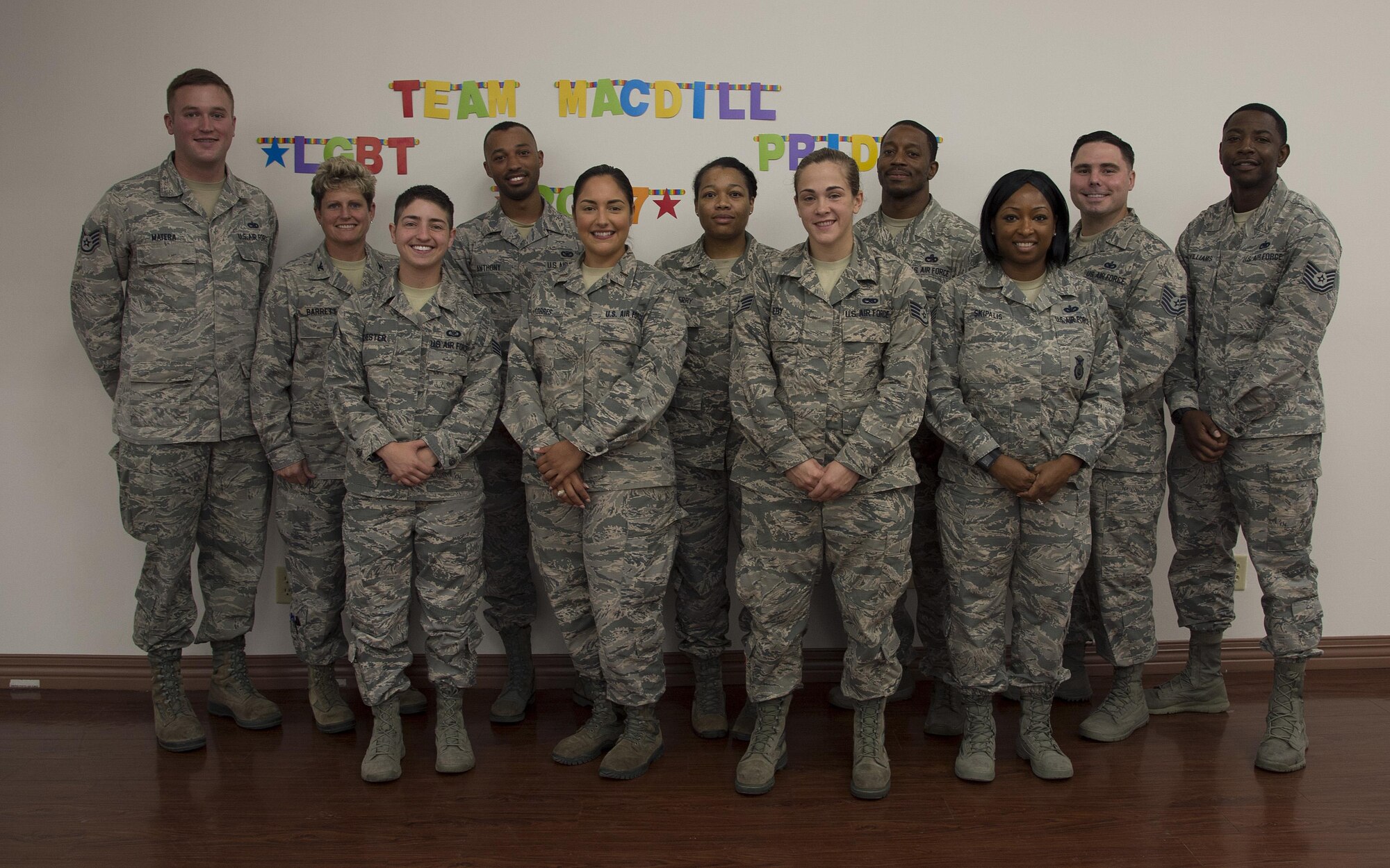 Members of MacDill’s Pride Committee and panel participants pause for a photo at the close of the Pride Luncheon at MacDill Air Force Base, Fla., June 15, 2017. The purpose of Pride Month is to recognize the impact lesbian, gay, bisexual and transgender service members and civilians have had on our nation. (U.S. Air Force Photo by Airman 1st Class Ashley Perdue)