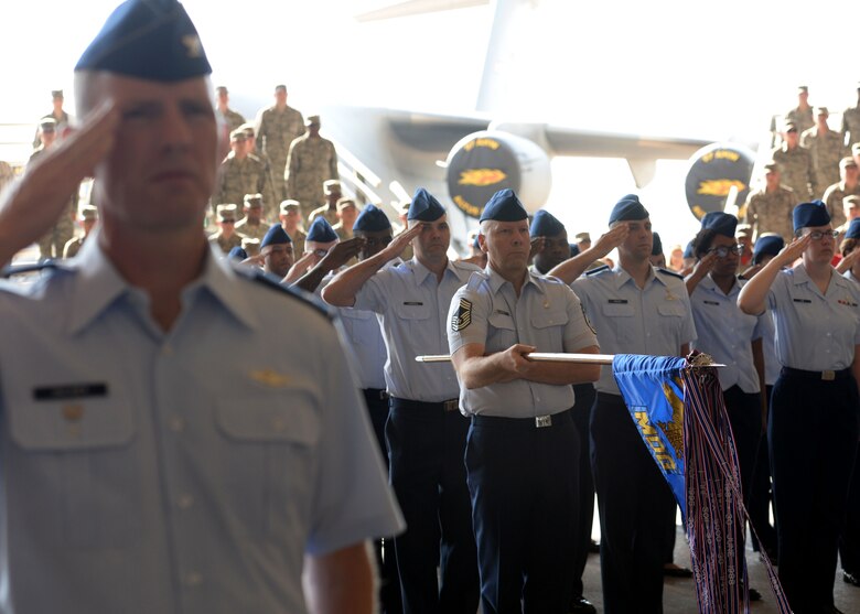 Members of the 97th Air Mobility Wing salute U.S. Air Force Col. Eric Carney, 97th AMW commander, during the 97th Air Mobility Wing Change of Command, June 16, 2017, at Altus Air Force Base, Oklahoma. U.S. Air Force Col. Todd Hohn relinquished command of the wing to U.S. Air Force Col. Eric Carney, he will lead the base in the mission of forging combat mobility forces and deploying Airmen warriors. (U.S. Air Force Photo by Airman 1st Class Jackson N. Haddon/Released).