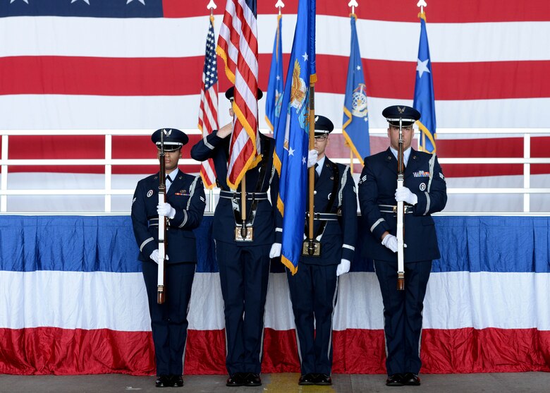 Members of the Altus Air Force Base Honor Guard post the Colors during the 97th Air Mobility Wing Change of Command, June 16, 2017, at Altus Air Force Base, Oklahoma. U.S. Air Force Col. Todd Hohn relinquished command of the wing to U.S. Air Force Col. Eric Carney, he will lead the base in the mission of forging combat mobility forces and deploying Airmen warriors. (U.S. Air Force Photo by Airman 1st Class Jackson N. Haddon/Released).
