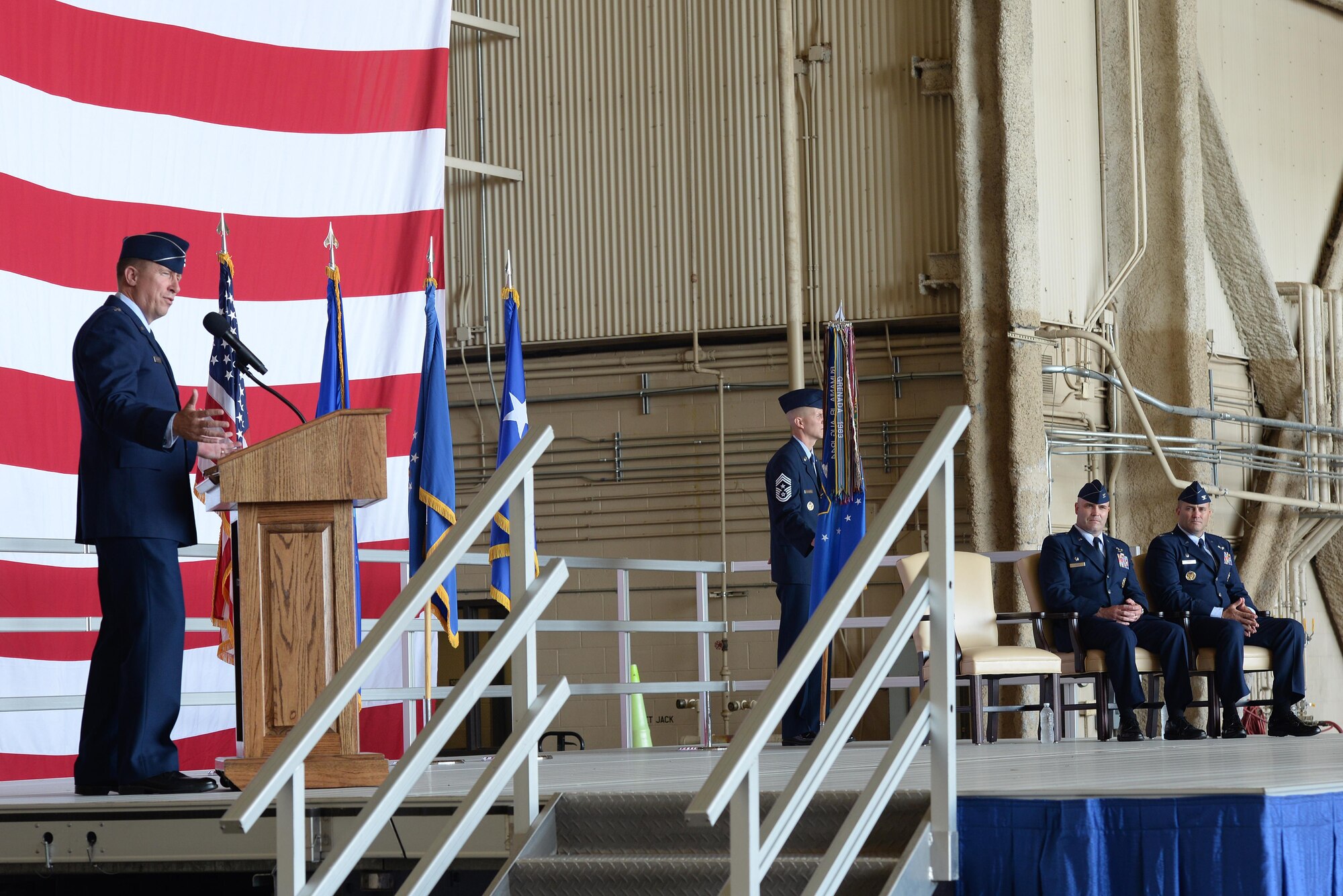 U.S. Air Force Major General Patrick J. Doherty, 19th Air Force commander, speaks to the 97th Air Mobility Wing during the 97th AMW Change of Command ceremony, June 16, 2017, at Altus Air Force Base, Oklahoma. U.S. Air Force Col. Todd Hohn relinquished command of the wing to U.S. Air Force Col. Eric Carney, he will lead the base in the mission of forging combat mobility forces and deploying Airmen warriors. (U.S. Air Force Photo by Airman 1st Class Jackson N. Haddon/Released).