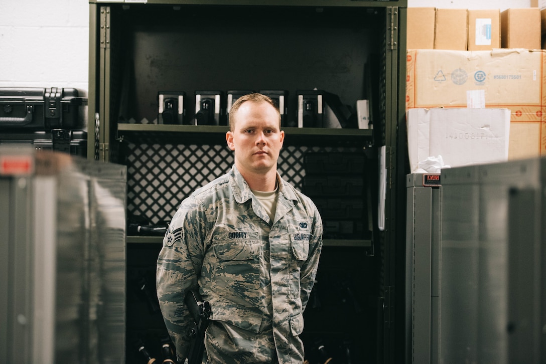 Senior Airman Chance Dority, 11th Security Support Squadron armorer, poses for a photo inside the armory at Joint Base Andrews, Md., June 12, 2017. Every day, the armory serves National Capital Region customers, including members of the 11th Security Forces Group, augmentees and private gun owners. (U.S. Air Force photo by Senior Airman Delano Scott)
