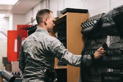 Senior Airman Chance Dority, 11th Security Support Squadron armorer, charges a radio battery inside the armory at Joint Base Andrews, Md., June 12, 2017. Every day, the armory serves National Capital Region customers, including members of the 11th Security Forces Group, augmentees and private gun owners. (U.S. Air Force photo by Senior Airman Delano Scott)