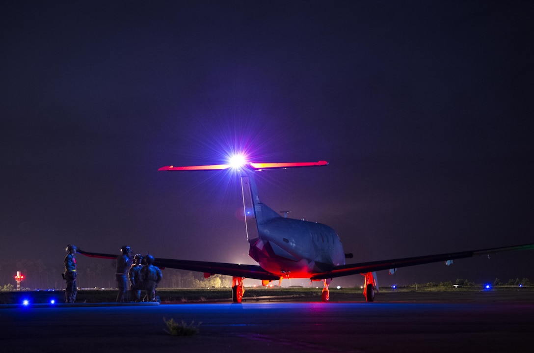 Air Commandos with the 1st Special Operations Logistics Readiness Squadron prepare to refuel a Pilatus PC-12 assigned to the 319th Special Operations Squadron during a forward area refueling point operation at Hurlburt Field, Fla., June 13, 2017. Forward area refueling points enable global reach and mission accomplishment. (U.S. Air Force photo by Airman 1st Class Joseph Pick)