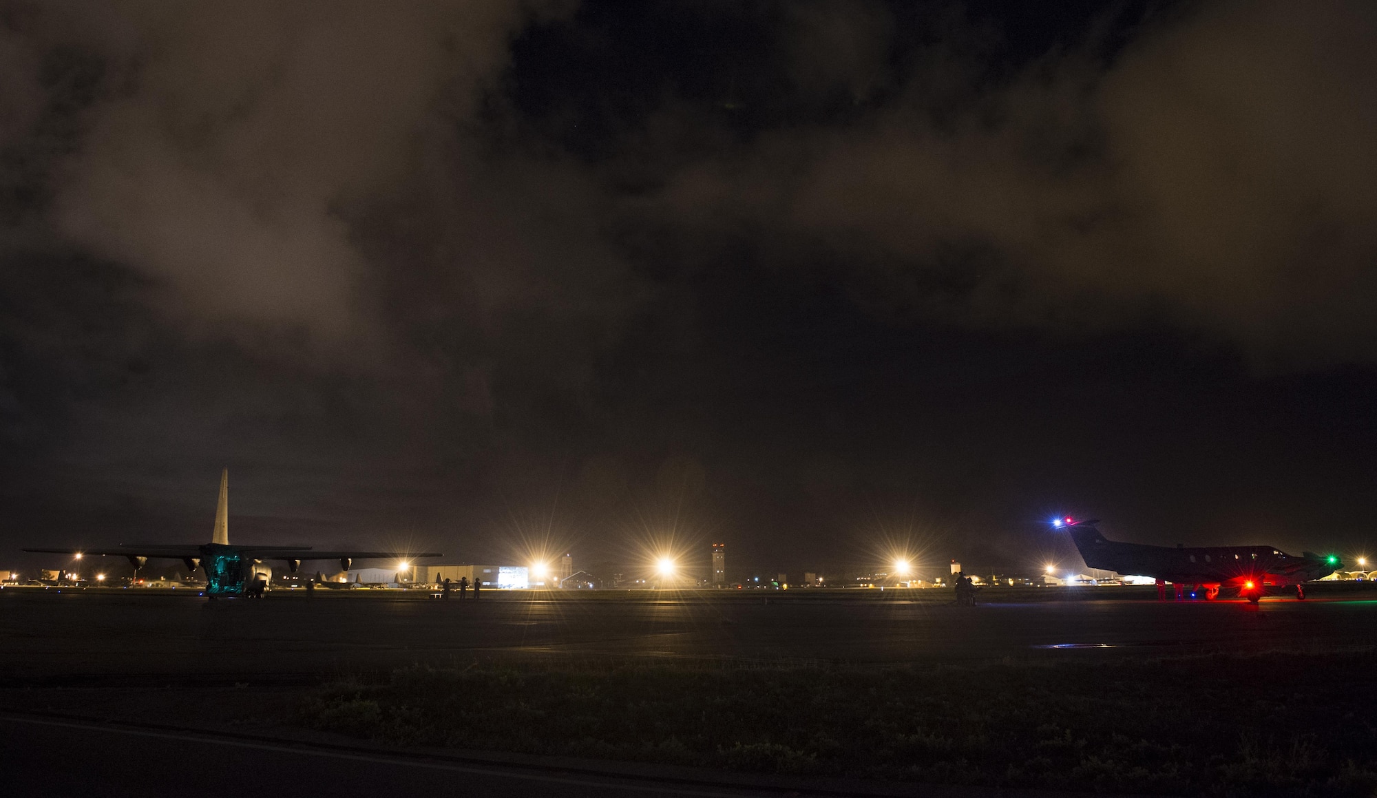 Air Commandos with the 1st Special Operations Logistic Readiness Squadron conduct a forward area refueling point operation at Hurlburt Field, Fla., June 13, 2017. During the operation, a Pilatus PC-12 assigned to the 319th Special Operations Squadron received fuel from an EC-130J Commando Solo assigned to the 193rd Special Operations Wing, Middletown, Pa. The FARP program is a United States Special Operations Command initiative that performs nighttime refueling operations in deployed locations where fueling stations are not accessible or when air-to-air refueling is not possible. Forward area refueling points enable global reach and mission accomplishment. (U.S. Air Force photo by Airman 1st Class Joseph Pick)