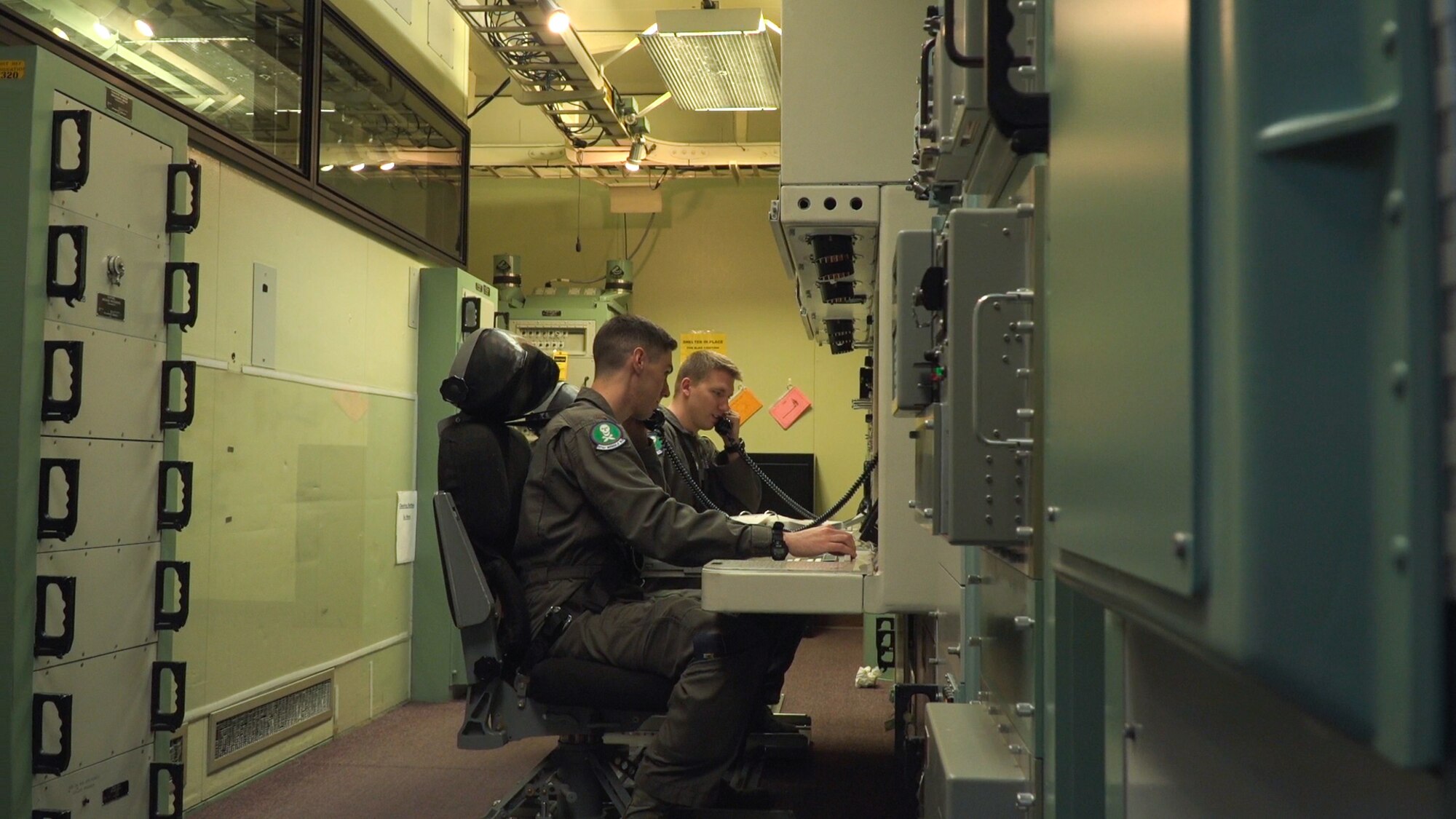 Missileers with the 321st Missile Squadron sit at the control console training for the 2017 Global Strike Challenge inside the Missile Procedures Trainer at F.E. Warren Air Force Base, Wyo., June 5, 2017. The missileers portion is just one of the many competitions, spread out over the next several weeks, which make up the GSC. Approximately 450 competitors take part in GSC competitions at various locations. Competition categories rigorously test security forces, missile, bomber, helicopter and maintenance communities. (U.S. Air Force photo by Lan Kim)