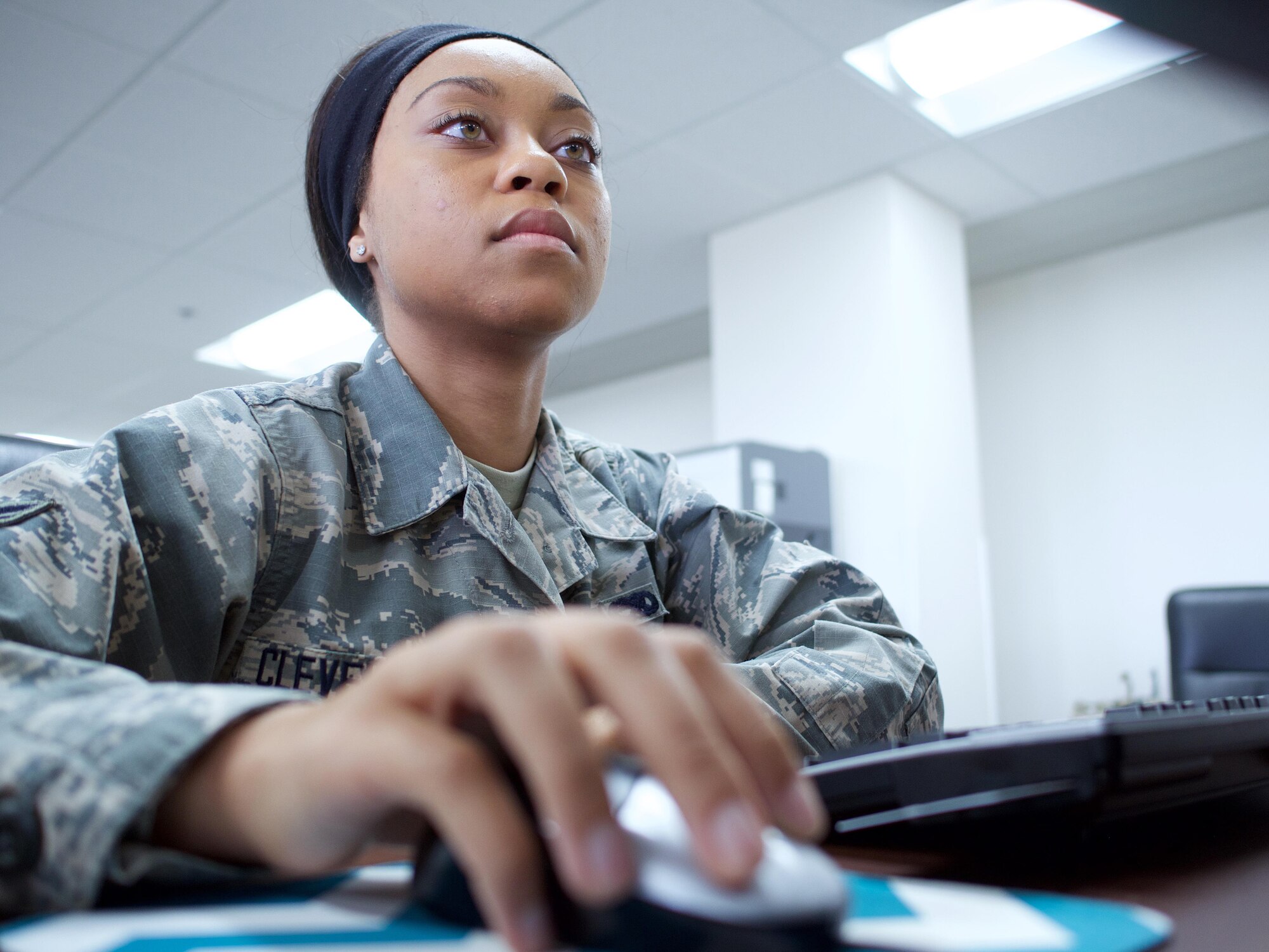 Airman 1st Class Cerina Cleveland, a maintenance scheduler with the 962nd Aircraft Maintenance Unit, logs into the Information Data Management System. Cleveland, a native of Los Angeles, uses IMDS for scheduling maintenance for 3rd Wing's E-3 Sentry Airborne Warning and Control System. 