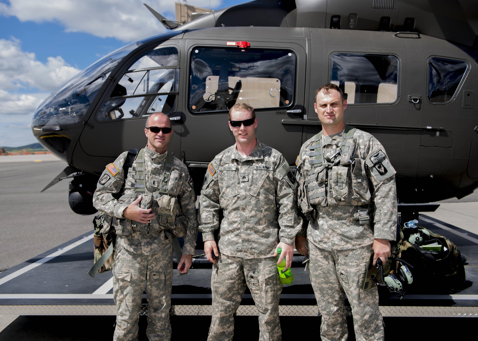 (from left to right) Chief Warrant Officer 3 Chris Haeder, Lakota pilot, Sgt. Darrell Russell, crew chief, and Chief Warrant Officer 2 Chris Mason, Lakota pilot of C Company, 1st Battalion, 112th Airborne Regiment, stand outside their helicopter June 14, 2017, at Fairchild Air Force Base, Washington. The National Guard 112th Airborne Regiment are a tenant unit at Fairchild.
(U.S. Air Force photo / Airman 1st Class Ryan Lackey)