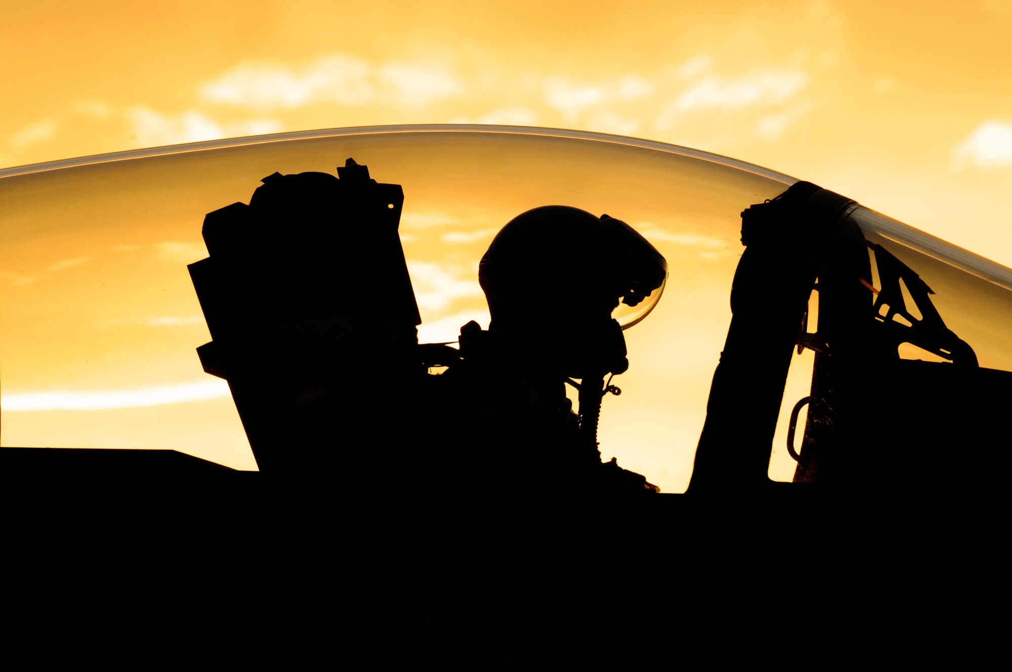 As the sun begins to set at Nellis Air Force Base, Nev., Oregon Air National Guard Lt. Col. Nick Rutgers, assigned to the 123rd Fighter Squadron, 142nd Fighter Wing, prepares his F-15 Eagle for a late day sortie, June 8, 2017. Over 120 Oregon Air guardsmen are supporting the Weapons Instructor Course during their three-week duty assignment. (U.S. Air National Guard photo/Master Sgt. John Hughel)