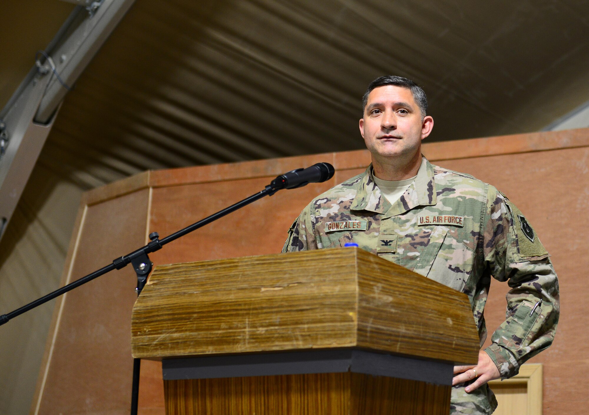 U.S. Air Force Col. John F. Gonzales addresses the 407th Air Expeditionary Group Airmen for the first time as the new commander of the 407th AEG during the change of command ceremony on June 17, 2017 in Southwest Asia. The military’s change of command ceremony signifies the transfer of command. (U.S. Air Force Tech Sgt. Andy M. Kin)