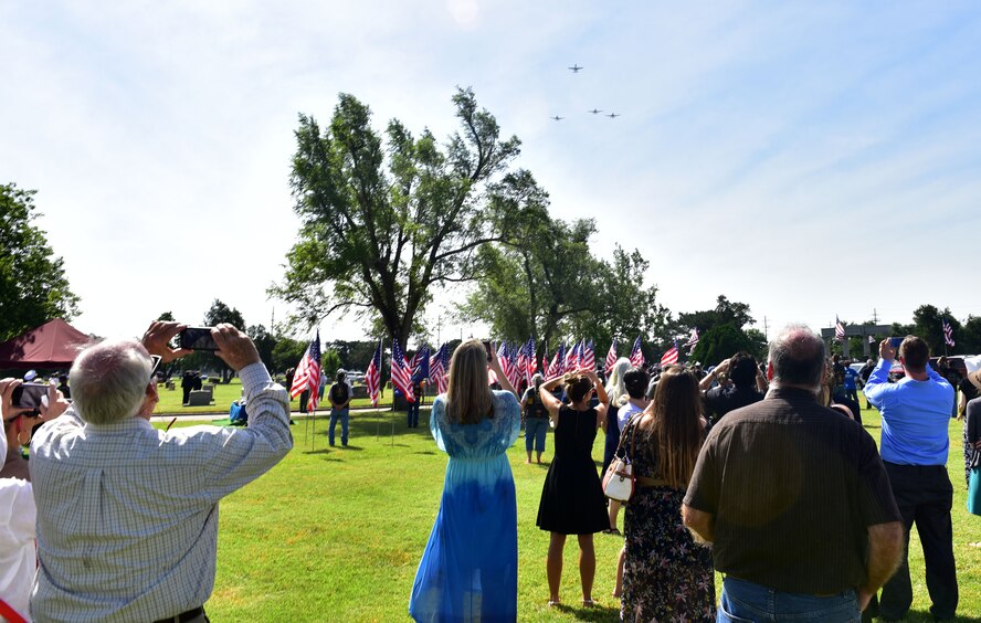 A-10 Thunderbolt IIs from Moody Air Force Base, Ga. perform a missing man flyover during the funeral of John Dean Armstrong, a member of the Flying Tigers, June 17, 2017, in Hutchinson, Kan. The A-10s are from the 23rd Fighter Group, which traces its lineage to the American Volunteer Group, the Flying Tigers. (U.S. Air Force photo/Staff Sgt. Trevor Rhynes)