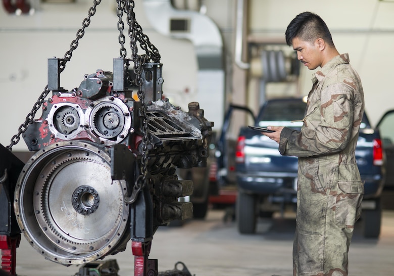 U.S. Air Force Senior Airman Ruebert Bantigue, 51st Logistics Readiness Squadron vehicle maintainer, reads a digital technical order (TO) in the Vehicle Maintenance shop at Osan Air Base, Republic of Korea on June 13, 2017. The shop recently upgraded their outdated paper TO system with a digital library that can be viewed from a tablet. (U.S. Air Force photo by Staff Sgt. Alex Fox Echols III)