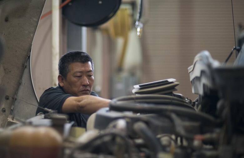 Pak Min-ok, 51st Logistics Readiness Squadron vehicle maintainer, repairs a street sweeper in the Vehicle Maintenance shop at Osan Air Base, Republic of Korea on June 13, 2017. The Vehicle Maintenance unit ensures Team Osan’s 1,300 government owned vehicles remain mission capable. (U.S. Air Force photo by Staff Sgt. Alex Fox Echols III)