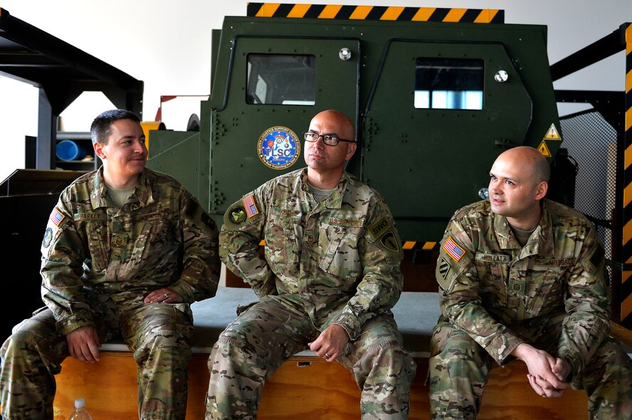 (From left) U.S. Air Force Master Sgts. Jason Barkey, Richard Koch, and Steven Hollatz, all from the 7th Weather Squadron, sit in front of a Humvee egress assistance trainer on Lucius D. Clay Kaserne, Germany, June 14, 2017. The 7th WS conducted Exercise Cadre Focus 17-1, which aims to enhance the ability of its Airmen to cooperate with the U.S. Army in Europe. While administratively part of the Air Force, the squadron provides weather support to the U.S. Army. (U.S. Air Force photo by Airman 1st Class Joshua Magbanua)


