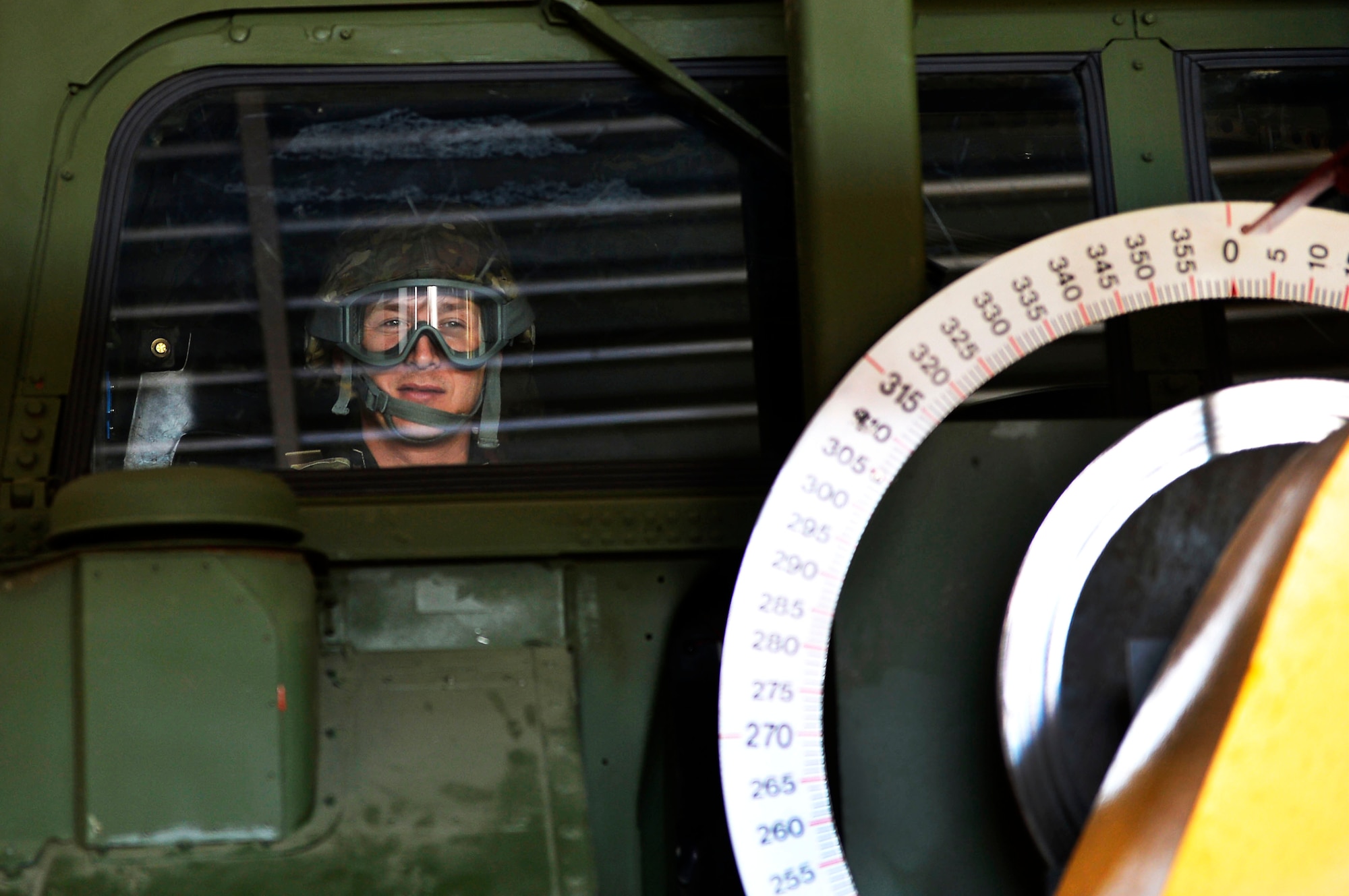 Maj. Richard Büki, a senior meteorologist for the Geoinformation Service of the Hungarian Defense Forces, sits in a Humvee egress assistance trainer on Lucius D. Clay Kaserne, Germany, June 14, 2017. NATO allies from Germany, Poland, and Hungary, participated in the 7th Weather Squadron’s Exercise Cadre Focus 17-1. 2017 is the first year Hungarian service members participated in the exercise. (U.S. Air Force photo by Airman 1st Class Joshua Magbanua)