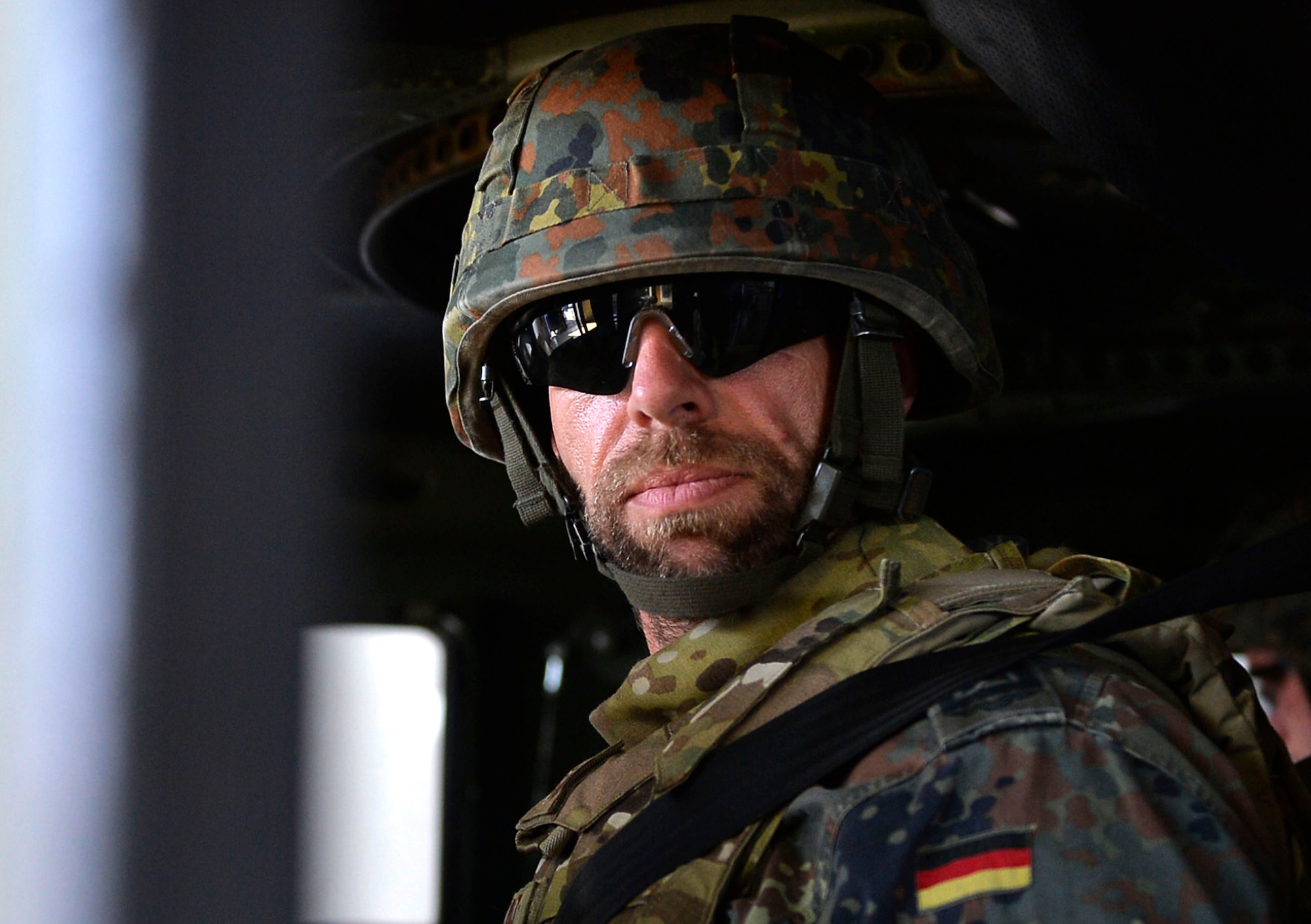 German Air Force Senior Master Sgt. Guido Jantos sits in a Humvee egress assistance trainer on Lucius D. Clay Kaserne, Germany, June 14, 2017. The 7th Weather Squadron invited NATO allies to participate in Exercise Cadre Focus 17-1. The exercise aimed to enhance the ability of 7th WS Airmen to integrate with the U.S. Army. (U.S. Air Force photo by Airman 1st Class Joshua Magbanua)