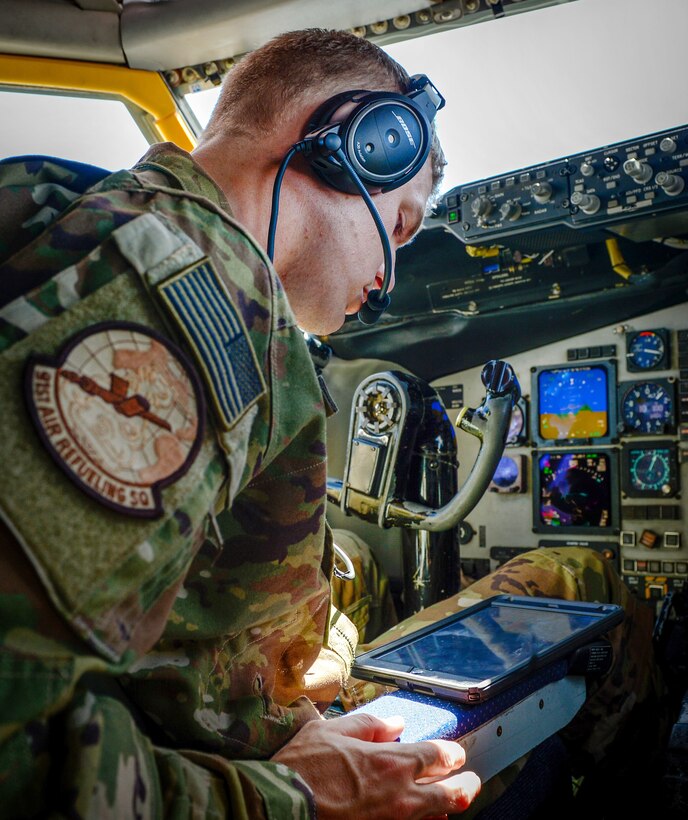 Air Force Capt. Christopher Chorney reviews a mission document during a flight in support of Operation Inherent Resolve, June 9, 2017. Chorney is a pilot assigned to the 340th Expeditionary Air Refueling Squadron. Air Force photo by Staff Sgt. Michael Battles