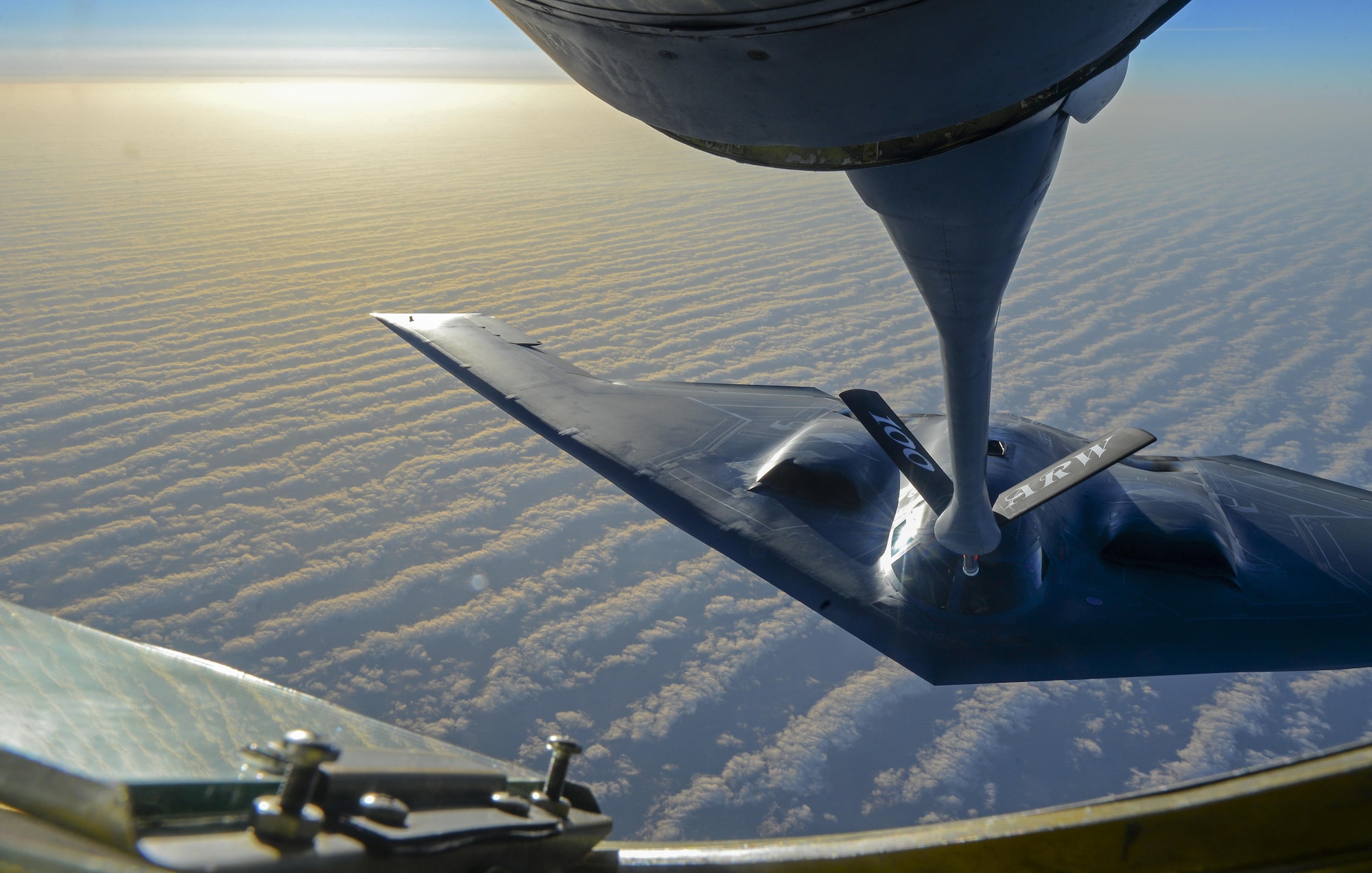 A U.S. Air Force B-2 Spirit from Whiteman Air Force Base, Mo., flies into position to receive fuel from a KC-135 Stratotanker assigned to the 100th Air Refueling Wing, RAF Mildenhall, England, off the coast of Spain, June 13, 2017. The B-2 brings massive firepower to bear, in a short time, anywhere around the globe. The aircraft’s capability to penetrate air defenses and threaten effective retaliation provides a strong, effective deterrent and combat force well into the 21st century. (U.S. Air Force photo by Staff Sgt. Micaiah Anthony)