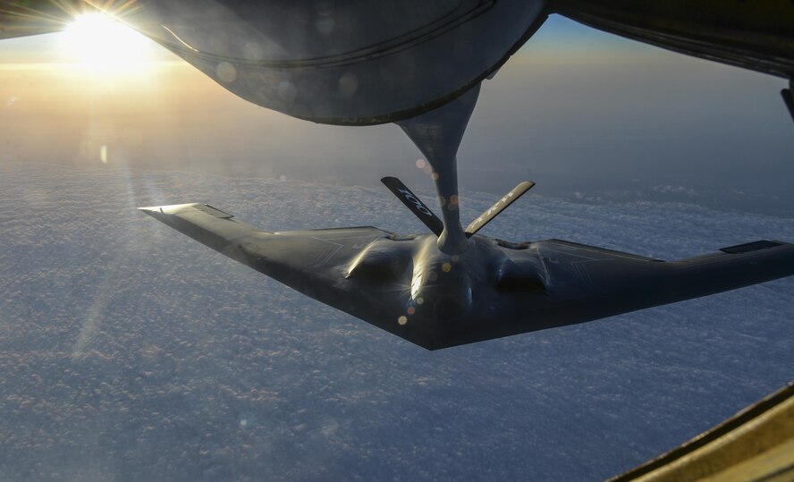 A U.S. Air Force B-2 Spirit from Whiteman Air Force Base, Mo., flies away after receiving fuel from a KC-135 Stratotanker assigned to the 100th Air Refueling Wing, RAF Mildenhall, England, off the coast of Spain, June 13, 2017. Two B-2s deployed to the U.K. to participate in theater bomber assurance and deterrence operations. Bomber deployments enhance the readiness and training necessary to respond to any contingency or challenge across the globe. (U.S. Air Force photo by Staff Sgt. Micaiah Anthony)
