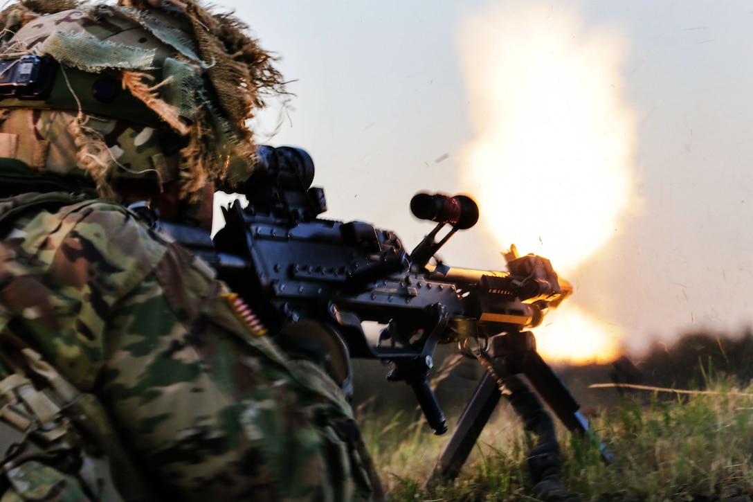 A soldier fires an M249 crew machinegun during exercise Saber Strike 17 at the Bemowo Piskie Training Area, Poland, June 14, 2017. Army photo by Spc. Samuel Brooks