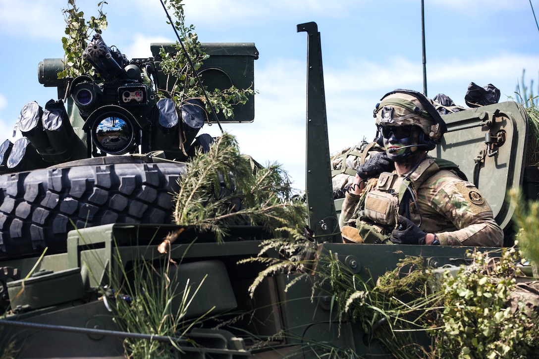 A soldier scans the perimeter from the turret of his tactical vehicle during exercise Saber Strike 17 at the Bemowo Piskie Training Area near Orzysz, Poland, June 15, 2017. Army photo by Spc. Stefan English