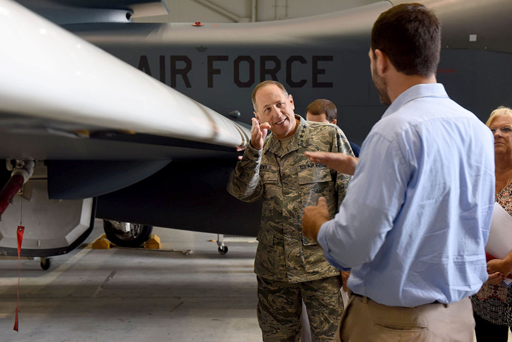 Lt. Gen. Lee Levy II, Air Force Sustainment Center commander, met with  members of Team Robins about work being done on a Global Hawk here during his site visit June 13. This is the first time a Global Hawk has flown into  an Air Force air logistics complex. Warner Robins Air Logistics Complex maintenance professionals are meticulously painting the aircraft to prevent corrosion. Robins Air Force Base is the first installation to have a building-based Launch and Recovery Element, allowing the aircraft to take off and land from this location. While a programmed depot maintenance requirement for Global Hawk has not been established, the Air Force recognizes that having an organic maintenance capability for Global Hawk enhances our ability to manage the fleet and keep this resource flying. (U.S. Air Force photo/TOMMIE HORTON) 
