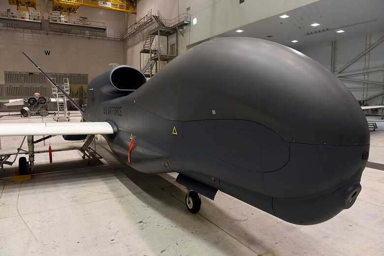 Lt. Gen. Lee Levy II, Air Force Sustainment Center commander, met with  members of Team Robins about work being done on a Global Hawk here during his site visit June 13. This is the first time a Global Hawk has flown into  an Air Force air logistics complex. Warner Robins Air Logistics Complex maintenance professionals are meticulously painting the aircraft to prevent corrosion. Robins Air Force Base is the first installation to have a building-based Launch and Recovery Element, allowing the aircraft to take off and land from this location. While a programmed depot maintenance requirement for Global Hawk has not been established, the Air Force recognizes that having an organic maintenance capability for Global Hawk enhances our ability to manage the fleet and keep this resource flying. (U.S. Air Force photo/TOMMIE HORTON) 
