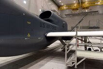 Lt. Gen. Lee Levy II, Air Force Sustainment Center commander, met with  members of Team Robins about work being done on a Global Hawk here during his site visit June 13. This is the first time a Global Hawk has flown into  an Air Force air logistics complex. Warner Robins Air Logistics Complex maintenance professionals are meticulously painting the aircraft to prevent corrosion. Robins Air Force Base is the first installation to have a building-based Launch and Recovery Element, allowing the aircraft to take off and land from this location. While a programmed depot maintenance requirement for Global Hawk has not been established, the Air Force recognizes that having an organic maintenance capability for Global Hawk enhances our ability to manage the fleet and keep this resource flying. (U.S. Air Force photo/TOMMIE HORTON) 
