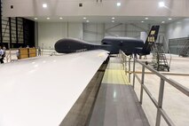 Lt. Gen. Lee Levy II, Air Force Sustainment Center commander, met with  members of Team Robins about work being done on a Global Hawk here during his site visit June 13. This is the first time a Global Hawk has flown into  an Air Force air logistics complex. Warner Robins Air Logistics Complex maintenance professionals are meticulously painting the aircraft to prevent corrosion. Robins Air Force Base is the first installation to have a building-based Launch and Recovery Element, allowing the aircraft to take off and land from this location. While a programmed depot maintenance requirement for Global Hawk has not been established, the Air Force recognizes that having an organic maintenance capability for Global Hawk enhances our ability to manage the fleet and keep this resource flying. (U.S. Air Force photo/TOMMIE HORTON) 
