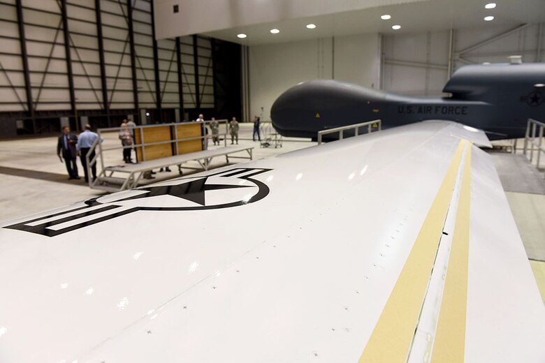 Lt. Gen. Lee Levy II, Air Force Sustainment Center commander, met with  members of Team Robins about work being done on a Global Hawk here during his site visit June 13. This is the first time a Global Hawk has flown into  an Air Force air logistics complex. Warner Robins Air Logistics Complex maintenance professionals are meticulously painting the aircraft to prevent corrosion. Robins Air Force Base is the first installation to have a building-based Launch and Recovery Element, allowing the aircraft to take off and land from this location. While a programmed depot maintenance requirement for Global Hawk has not been established, the Air Force recognizes that having an organic maintenance capability for Global Hawk enhances our ability to manage the fleet and keep this resource flying. (U.S. Air Force photo/TOMMIE HORTON) 
