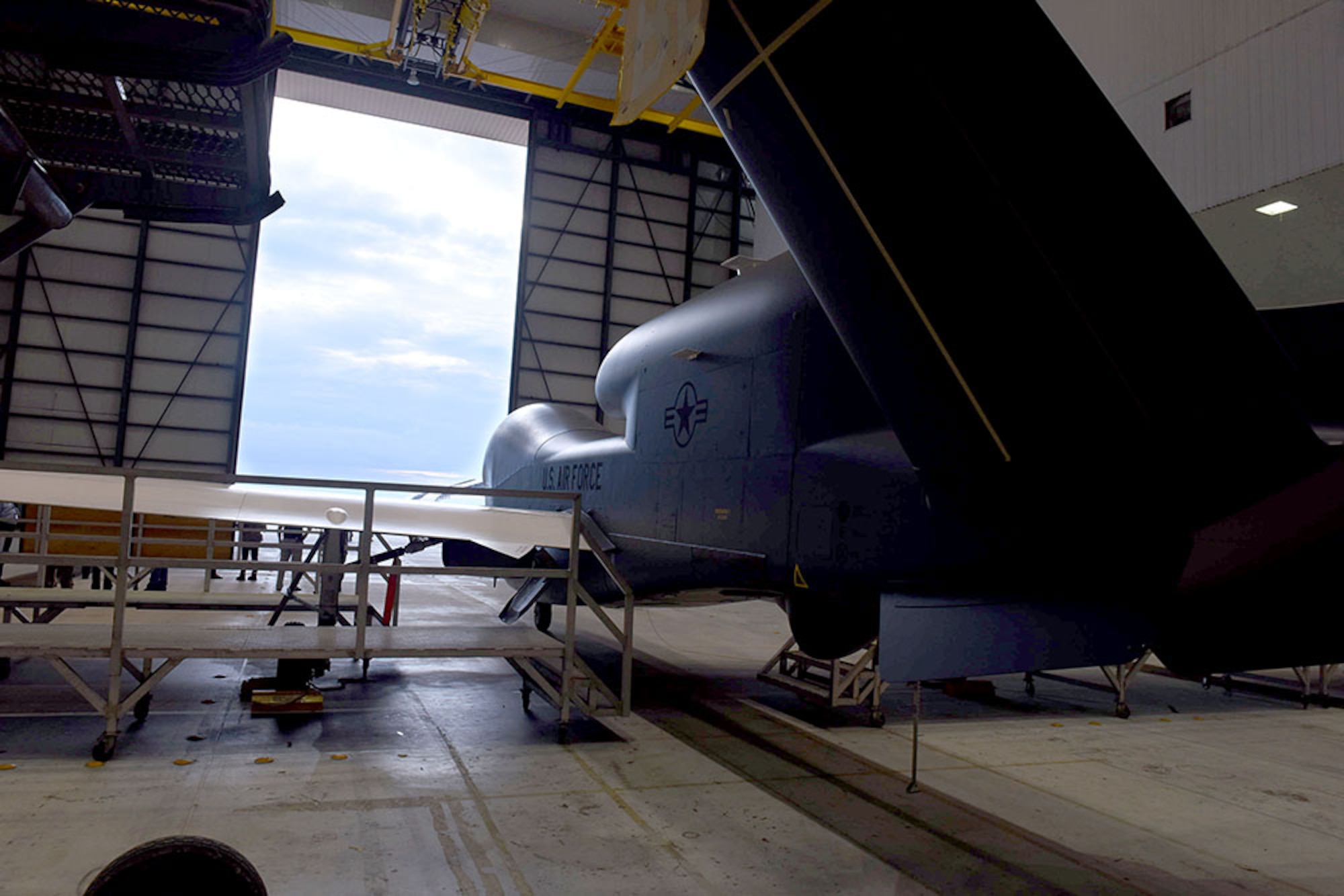 Lt. Gen. Lee Levy II, Air Force Sustainment Center commander, met with  members of Team Robins about work being done on a Global Hawk here during his site visit June 13. This is the first time a Global Hawk has flown into  an Air Force air logistics complex. Warner Robins Air Logistics Complex maintenance professionals are meticulously painting the aircraft to prevent corrosion. Robins Air Force Base is the first installation to have a building-based Launch and Recovery Element, allowing the aircraft to take off and land from this location. While a programmed depot maintenance requirement for Global Hawk has not been established, the Air Force recognizes that having an organic maintenance capability for Global Hawk enhances our ability to manage the fleet and keep this resource flying. (U.S. Air Force photo/TOMMIE HORTON) 
