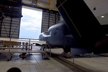Lt. Gen. Lee Levy II, Air Force Sustainment Center commander, met with  members of Team Robins about work being done on a Global Hawk here during his site visit June 13. This is the first time a Global Hawk has flown into  an Air Force air logistics complex. Warner Robins Air Logistics Complex maintenance professionals are meticulously painting the aircraft to prevent corrosion. Robins Air Force Base is the first installation to have a building-based Launch and Recovery Element, allowing the aircraft to take off and land from this location. While a programmed depot maintenance requirement for Global Hawk has not been established, the Air Force recognizes that having an organic maintenance capability for Global Hawk enhances our ability to manage the fleet and keep this resource flying. (U.S. Air Force photo/TOMMIE HORTON) 
