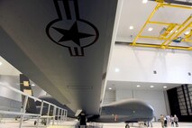Lt. Gen. Lee Levy II, Air Force Sustainment Center commander, met with  members of Team Robins about work being done on a Global Hawk here during his site visit June 13. This is the first time a Global Hawk has flown into  an Air Force air logistics complex. Warner Robins Air Logistics Complex maintenance professionals are meticulously painting the aircraft to prevent corrosion. Robins Air Force Base is the first installation to have a building-based Launch and Recovery Element, allowing the aircraft to take off and land from this location. While a programmed depot maintenance requirement for Global Hawk has not been established, the Air Force recognizes that having an organic maintenance capability for Global Hawk enhances our ability to manage the fleet and keep this resource flying. (U.S. Air Force photo/TOMMIE HORTON) 
