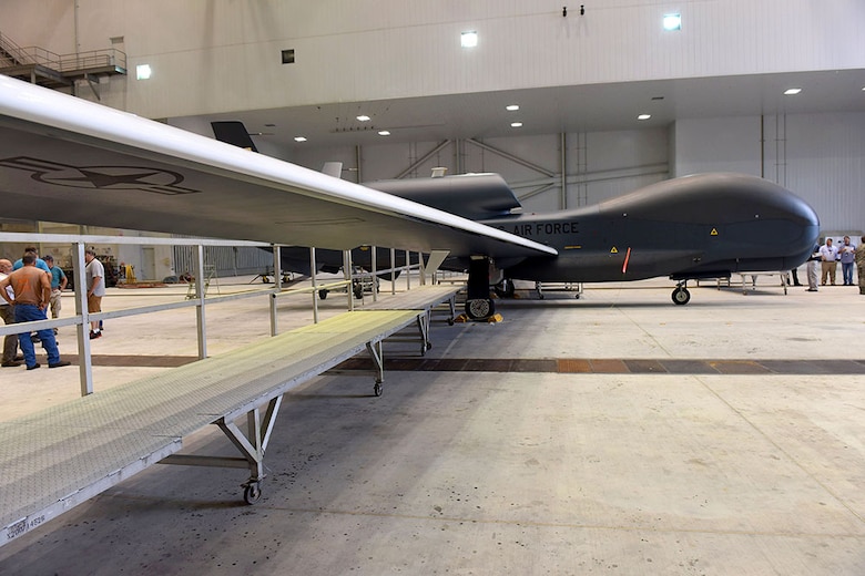 Lt. Gen. Lee Levy II, Air Force Sustainment Center commander, met with  members of Team Robins about work being done on a Global Hawk here during his site visit June 13. This is the first time a Global Hawk has flown into  an Air Force air logistics complex. Warner Robins Air Logistics Complex maintenance professionals are meticulously painting the aircraft to prevent corrosion. Robins Air Force Base is the first installation to have a building-based Launch and Recovery Element, allowing the aircraft to take off and land from this location. While a programmed depot maintenance requirement for Global Hawk has not been established, the Air Force recognizes that having an organic maintenance capability for Global Hawk enhances our ability to manage the fleet and keep this resource flying. (U.S. Air Force photo/TOMMIE HORTON) 
