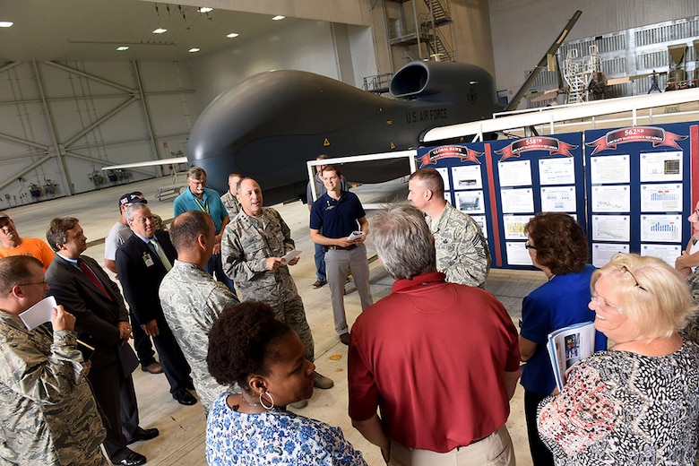 Lt. Gen. Lee Levy II, Air Force Sustainment Center commander, met with  members of Team Robins about work being done on a Global Hawk here during his site visit June 13. This is the first time a Global Hawk has flown into  an Air Force air logistics complex. Warner Robins Air Logistics Complex maintenance professionals are meticulously painting the aircraft to prevent corrosion. Robins Air Force Base is the first installation to have a building-based Launch and Recovery Element, allowing the aircraft to take off and land from this location. While a programmed depot maintenance requirement for Global Hawk has not been established, the Air Force recognizes that having an organic maintenance capability for Global Hawk enhances our ability to manage the fleet and keep this resource flying. (U.S. Air Force photo/TOMMIE HORTON) 
