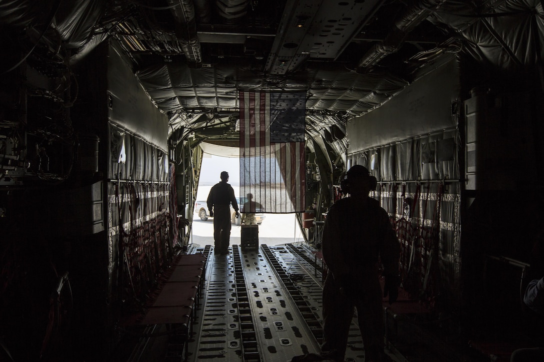 U.S. Marines stand inside a KC-130J, in the Central Command area of operations, June 18, 2017. Commandant of the Marine Corps Gen. Robert B. Neller visited Marines with Special Purpose Marine Air Ground Task Force Central Command engaged in Operation Inherent Resolve aimed at destroying ISIS. 