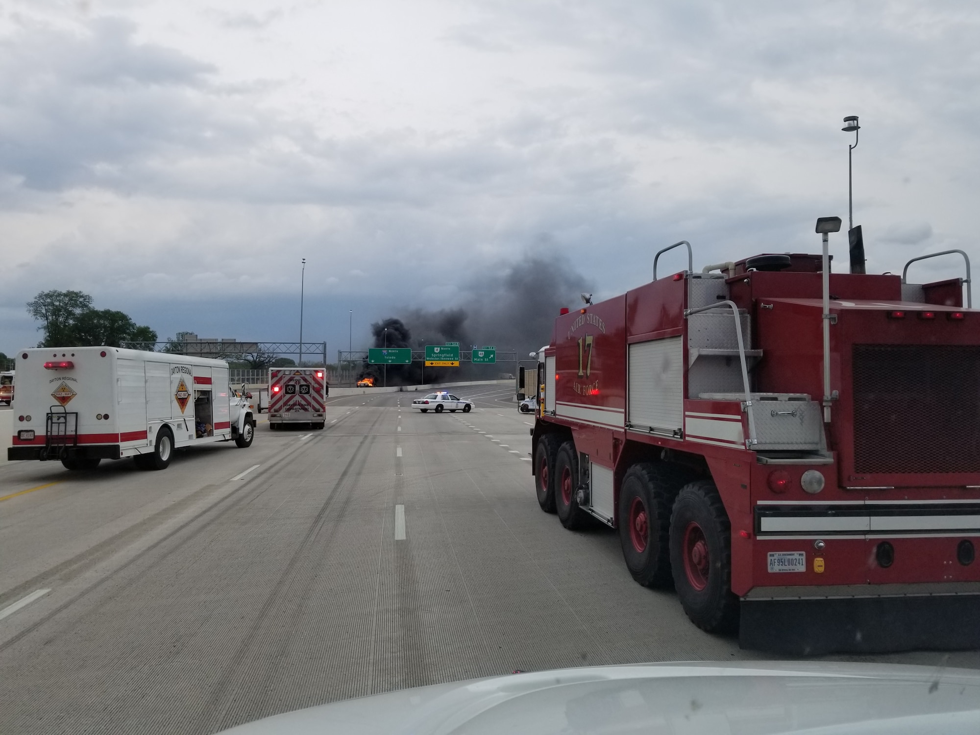 “Crash 17,” one of Wright-Patterson’s Aircraft Rescue and Fire Fighting trucks, arrives on site to assist Dayton first responders as they battle a major fuel fire on I-75 April 30, 2017 in Dayton, Ohio. The ARFF, specifically designed to combat aircraft fires, was called in to help due its unique capabilities in fighting fires of this type. (U.S. Air Force photo/Keith Hawkins)  