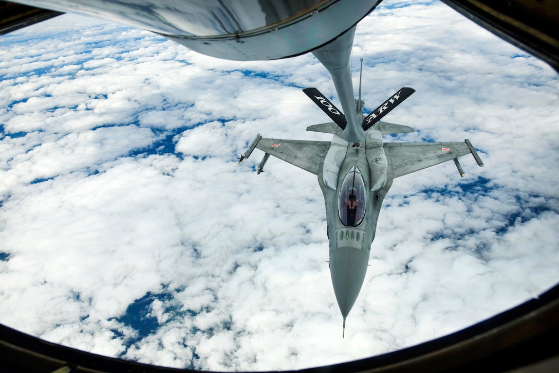 A Polish air force F-16 Fighting Falcon refuels from a KC-135R Stratotanker over Latvia, June 14, 2017. Air Force photo by Staff Sgt. Jonathan Snyder