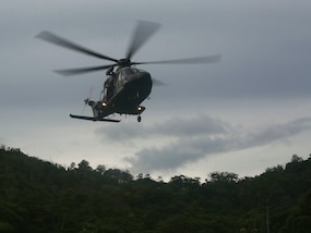 A Trinidad and Tobago Defense Force helicopter approaches its landing zone for insert as part of a simulated aerial and maritime raid during Exercise Tradewinds 2017 Phase II in Chaguaramas, Trinidad and Tobago, June 13, 2017. Tradewinds, an annual U.S. Southern Command-sponsored exercise, brings together 20 partner nations to increase Caribbean security and the combined ability to counter transnational terrorism and organize crime, and enhance humanitarian and disaster relief capabilities. (U.S. Marine Corps photo by Sgt. Olivia McDonald)