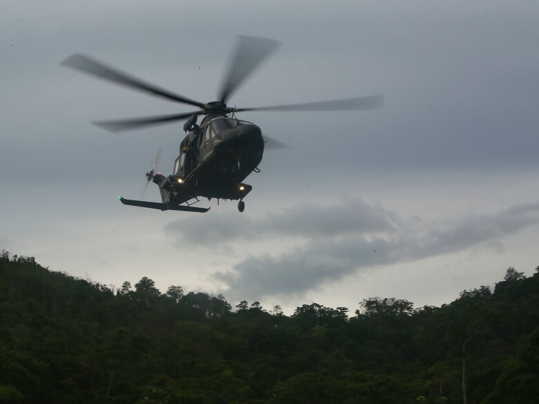 A Trinidad and Tobago Defense Force helicopter approaches its landing zone for insert as part of a simulated aerial and maritime raid during Exercise Tradewinds 2017 Phase II in Chaguaramas, Trinidad and Tobago, June 13, 2017. Tradewinds, an annual U.S. Southern Command-sponsored exercise, brings together 20 partner nations to increase Caribbean security and the combined ability to counter transnational terrorism and organize crime, and enhance humanitarian and disaster relief capabilities. (U.S. Marine Corps photo by Sgt. Olivia McDonald)