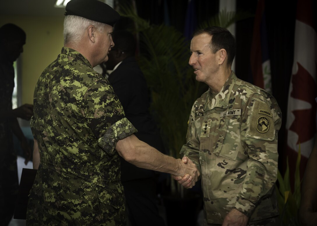 PORT OF SPAIN, Trinidad - Lieutenant-Colonel John Woodgate, Commanding Officer of 1st Field Artillery Regiment, greets Lieutenant-General Joseph DiSalvo from the United States Army during Exercise TRADEWINDS 17 closing ceremony in Chaguaramas, Trinidad and Tobago on June 17, 2017.

Photo: Avr Desiree T. Bourdon, Canadian Forces Joint Imagery Centre (CFJIC)
RE30-2017-0134-080