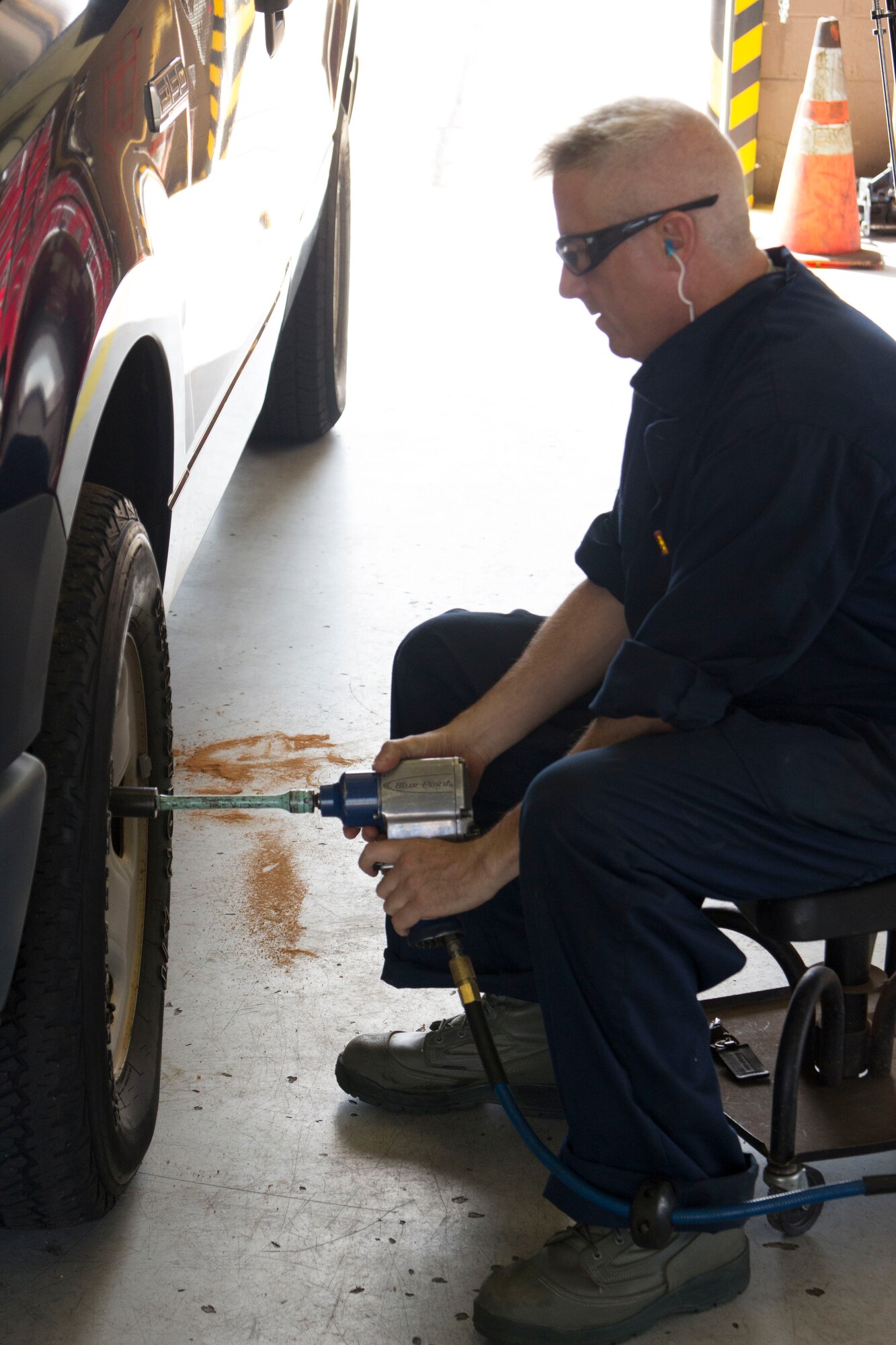 Tech. Sgt. Aaron Kincheloe, 442nd Logistics Readiness Squadron vehicle maintenance, uses a pneumatic impact
wrench to attach a wheel to a fleet vehicle at Eglin Air Force Base, Fla., during the squadron's deployment for training May 6-20.  Sixty-eight Citizen Airmen from the 442 LRS and 442nd Force Support squadron completed a two-week training tour at Eglin and Duke Field, Fla., to hone home station and mission-readiness skills.
