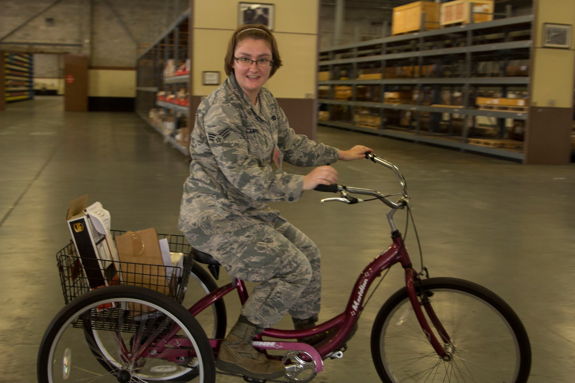 PR Hannah Campbell (TMO) -- Senior Amn. Hannah Campbell, 442nd Logistics Readiness Squadron Traffic Management Office, retrieves shipments of supplies via three-wheeled bike inside a warehouse at Eglin Air Force Base, Fla.   Sixty-eight Citizen Airmen from the 442 LRS and 442nd Force Support squadron completed a two-week training tour at Eglin and Duke Field, Fla., to hone home-station and mission-readiness skills.