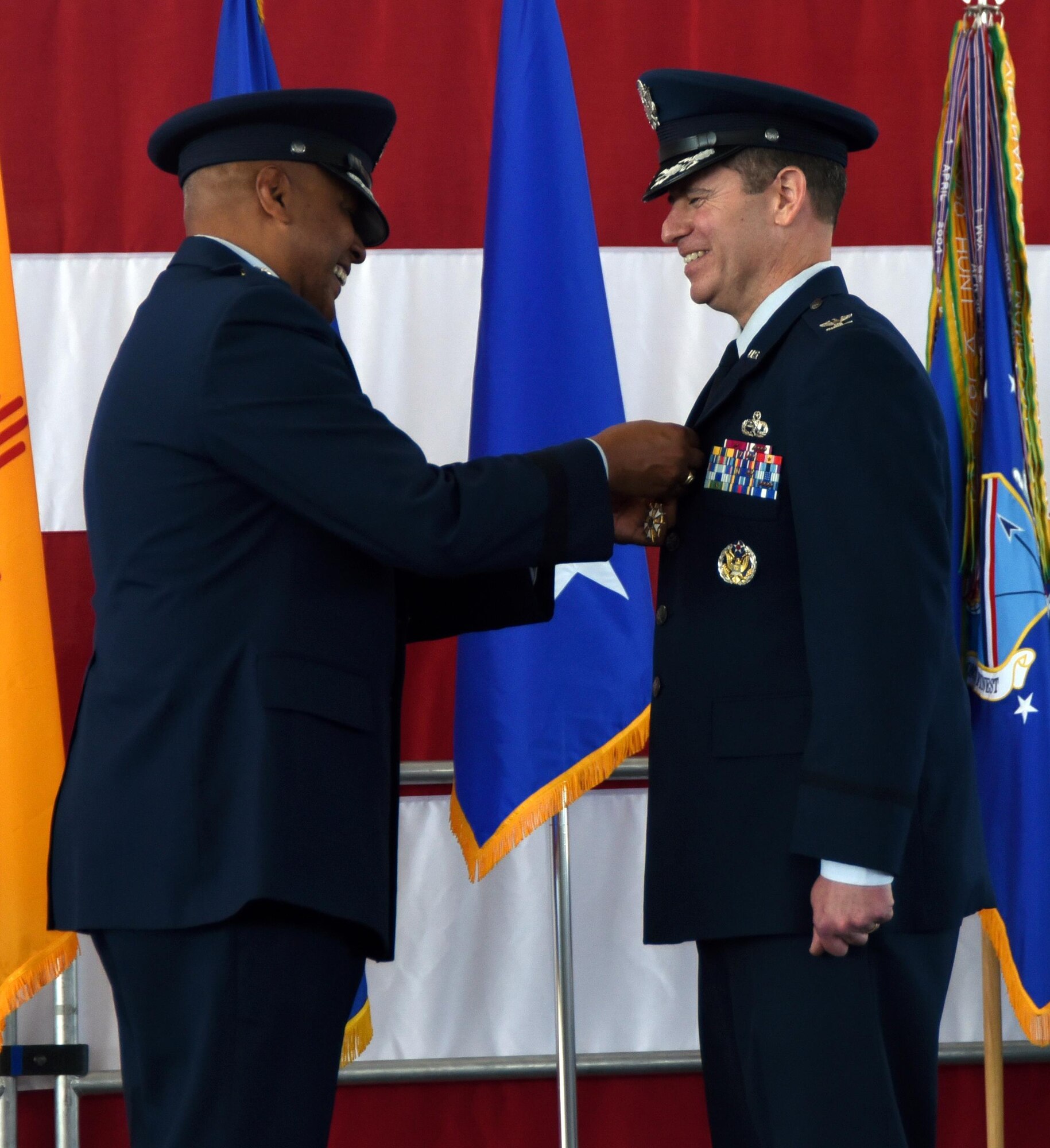 Maj. Gen. Anthony Cotton, 20th Air Force commander, pins the Legion of Merit on Col Eric H. Froehlich during a change of command ceremony at Kirtland Air Force Base, New Mexico, June 16. Froehlich commanded the wing during its first unit effectiveness inspection, where the wing was rated excellent. (U.S. Air Force photo by Senior Airman Chandler Baker)