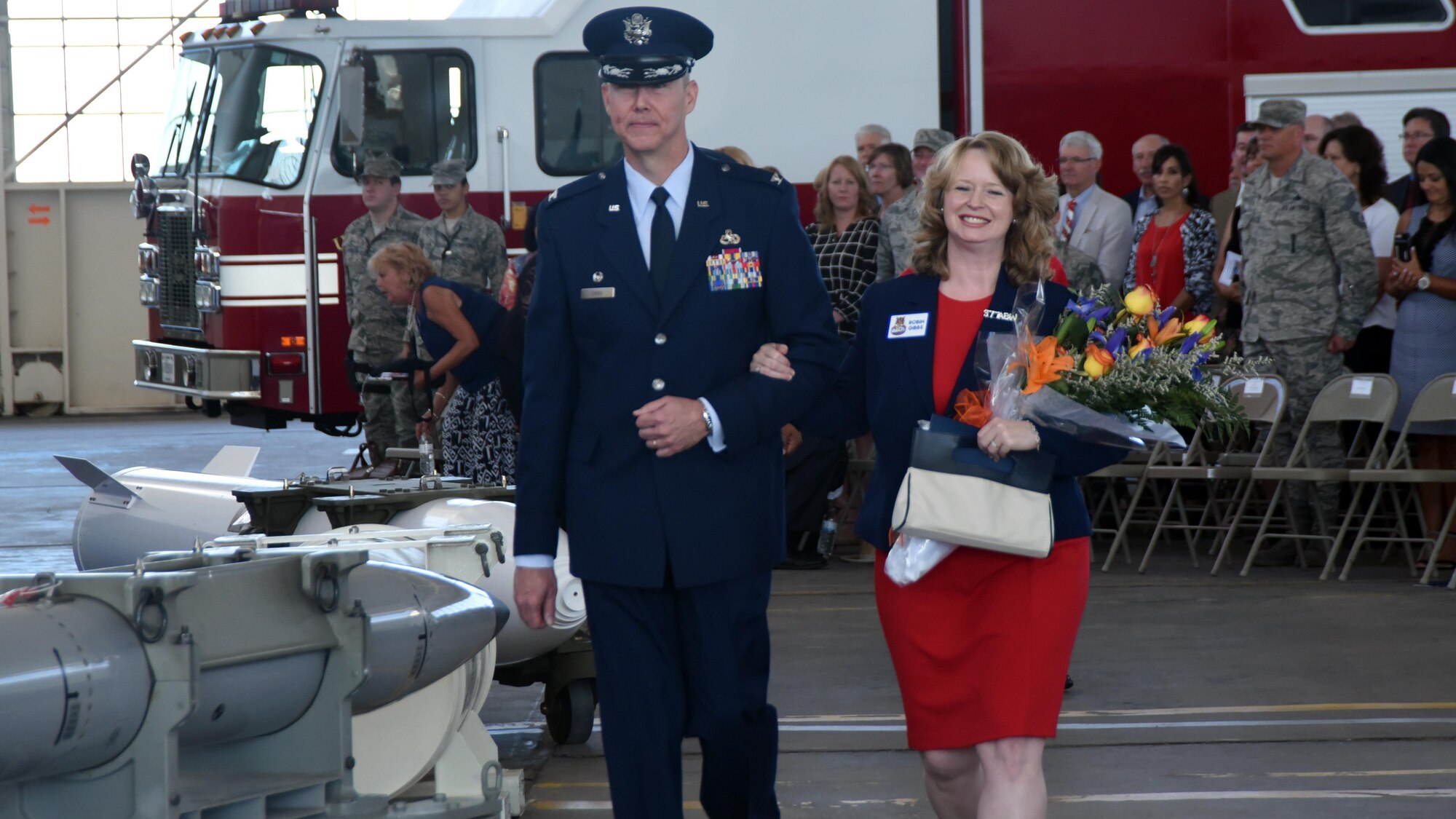 Col Richard W. Gibbs, 377th Air Base Wing commander, escorts his wife, Robin, following a change of command ceremony at Kirtland Air Force Base, New Mexico, June 16. Gibbs takes command of the host unit at Kirtland, which supports over 100 mission partners. (U.S. Air Force photo by Senior Airman Chandler Baker)