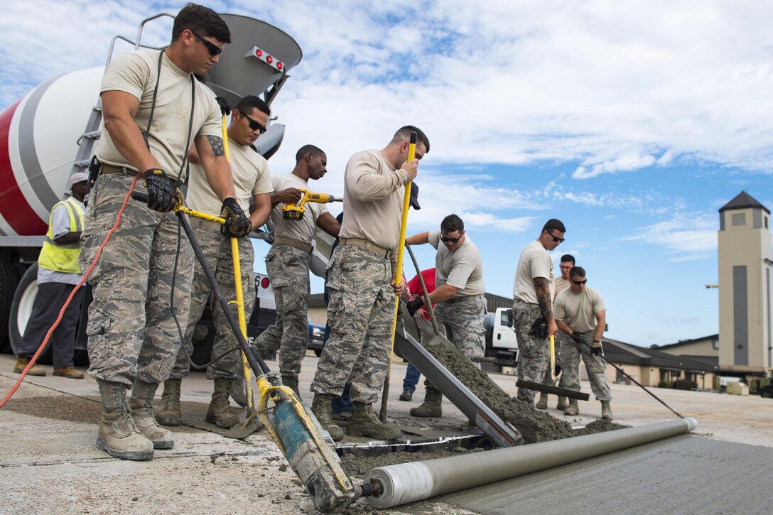 Students use various concrete leveling tools to finish a new patch of cement during a Pavements Maintenance, Inspection and Repair course, June 15, 2017, at Moody Air Force Base, Ga. Every year, training managers at the major command level across the Air Force pick multiple bases across the Air Force to host the course, and this year Moody hosted one from June 5-16. (U.S. Air Force photo by Senior Airman Janiqua P. Robinson)