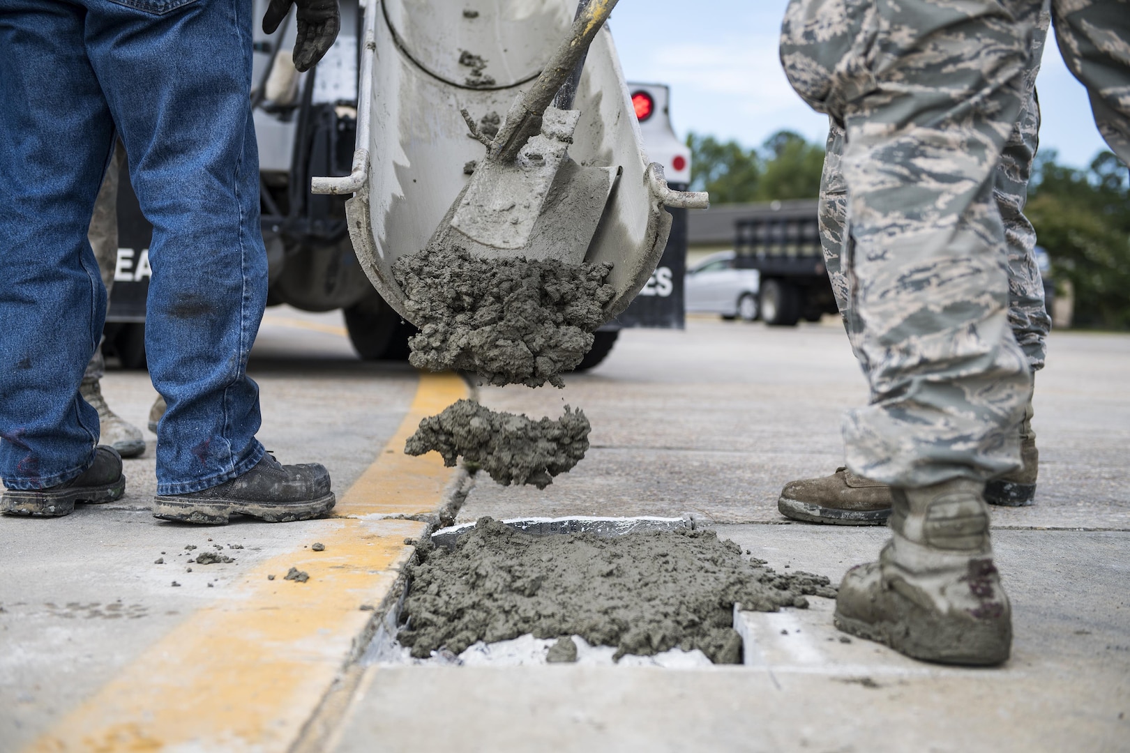 A student uses a leveling tool to finish a new patch of cement during a Pavements Maintenance, Inspection and Repair course, June 15, 2017, at Moody Air Force Base, Ga. Every year, training managers at the major command level across the Air Force pick multiple bases across the Air Force to host the course, and this year Moody hosted one from June 5-16. (U.S. Air Force photo by Senior Airman Janiqua P. Robinson)