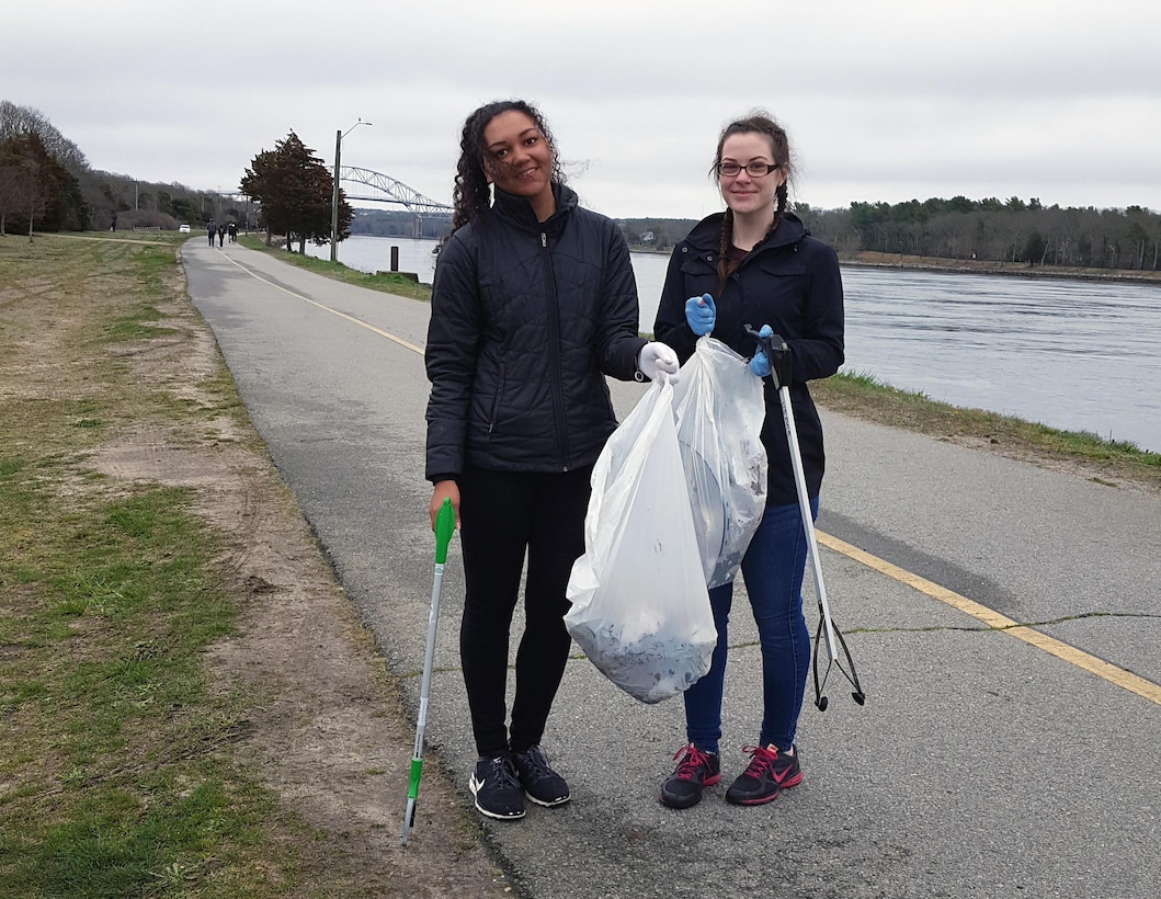 Volunteers from AmeriCorps, Cape Cod pick up trash along the banks of the Cape Cod Canal during the Cape Cod Canal Clean up event, April 22, 2017.